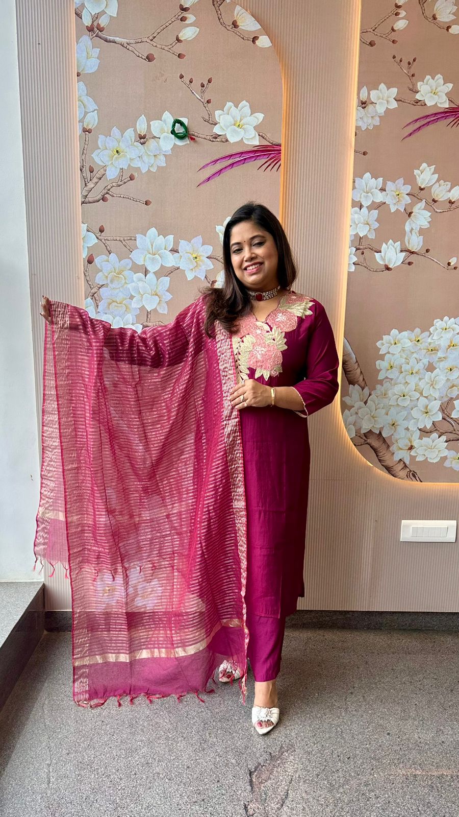 Pretty appliqué work silk suit set paired with tissue dupatta