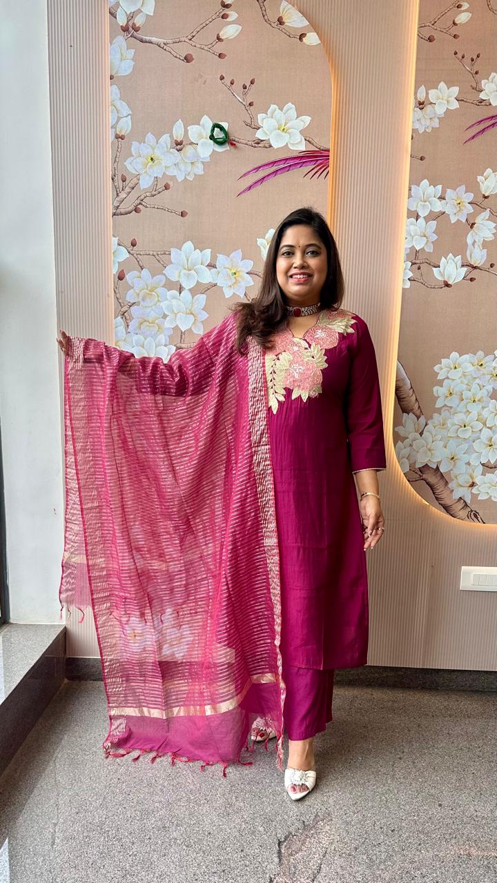 Pretty appliqué work silk suit set paired with tissue dupatta