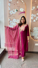 Pretty appliqué work silk suit set paired with tissue dupatta