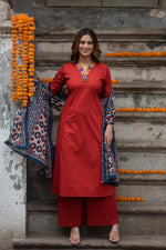 Designer pocket heavy embroidery on sleeves paired with a contrast Kalamkari dupatta cotton suit set in red