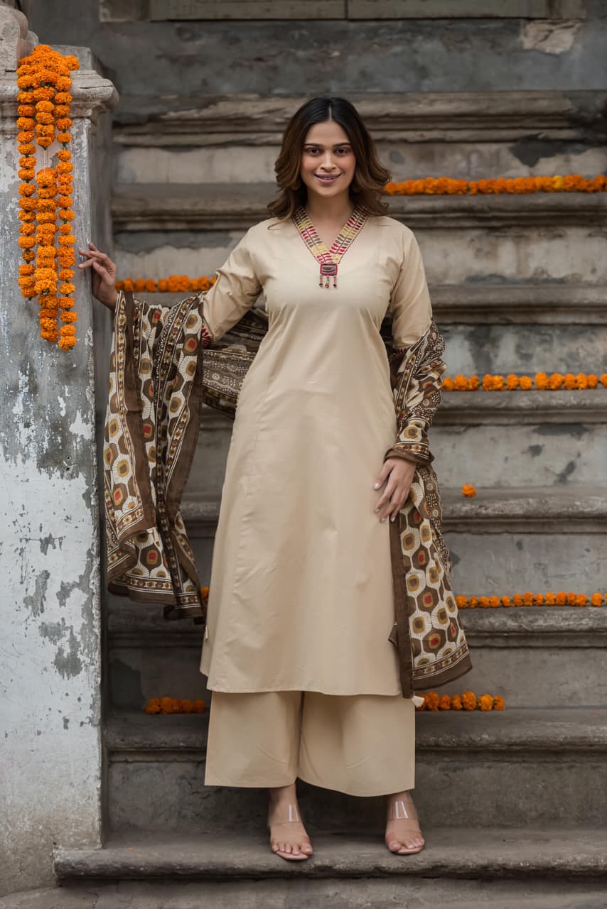 Designer pocket heavy embroidery on sleeves paired with a contrast Kalamkari dupatta cotton suit set in beige