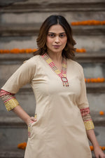 Designer pocket heavy embroidery on sleeves paired with a contrast Kalamkari dupatta cotton suit set in beige