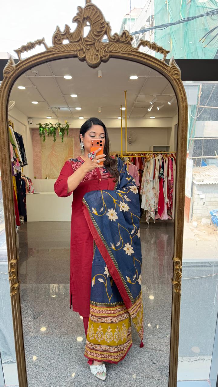 Premium cotton applique work cotton suit in red with pocket and paired with a Kalamkari