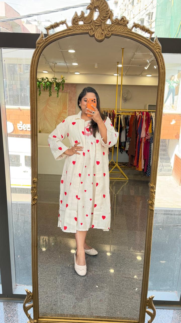 Organic cotton embroidered shrug dress. A smart piece