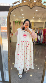 Organic cotton embroidered shrug dress. A smart piece