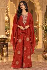 Pretty chinon hand word kaftan paired with brocade plazzo pants in orange