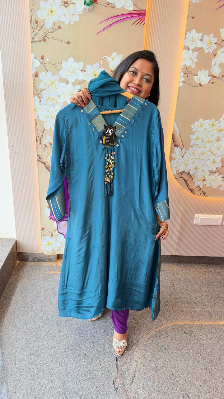 Ghungroo suit in teal blue with tissue detailing at the back