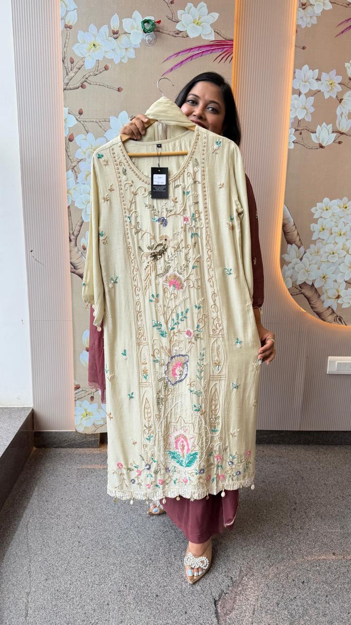 Pretty hand work dola silk suit set with pearl detailing and heavy handwork in cream