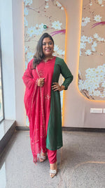 Pretty Banarasi Mul chanderi with pital tikka detailing in two tonegreen n red