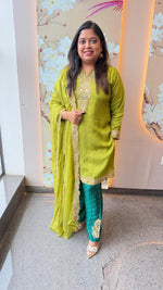 Designer suit set in soft silk fabric true to size in green paired with organza dupatta n zari detailing