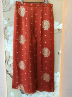 Pretty chinon hand word kaftan paired with brocade plazzo pants in orange