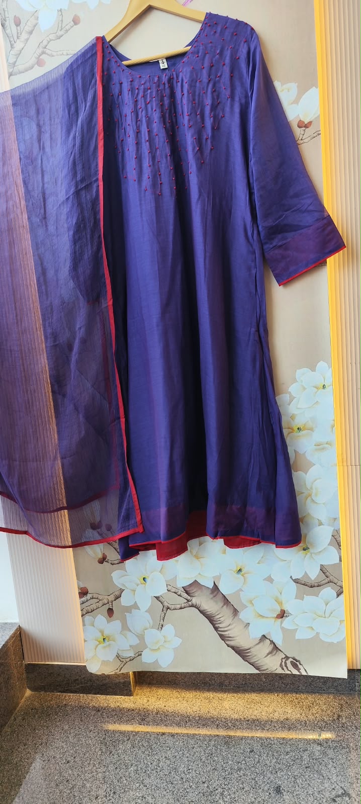 Pure Banarasi Mul chanderi with githan work and red border highlight all over paired with Kota doriya dupatta