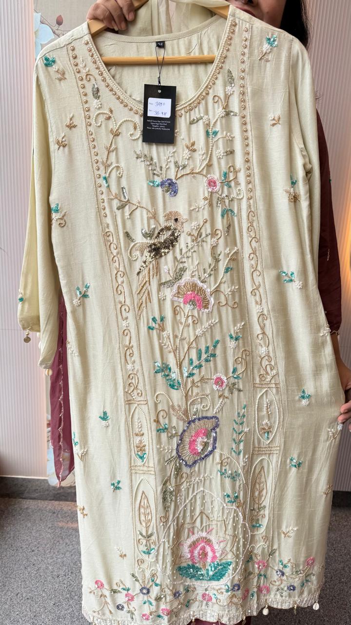 Pretty hand work dola silk suit set with pearl detailing and heavy handwork in cream
