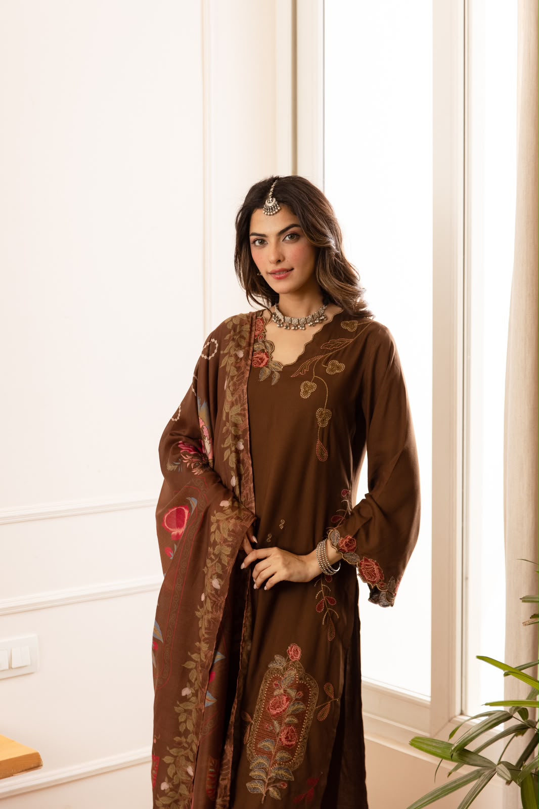 Cutwork suit paired with cutwork plazzo heavy slub cotton full suit in brown