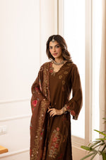 Cutwork suit paired with cutwork plazzo heavy slub cotton full suit in brown