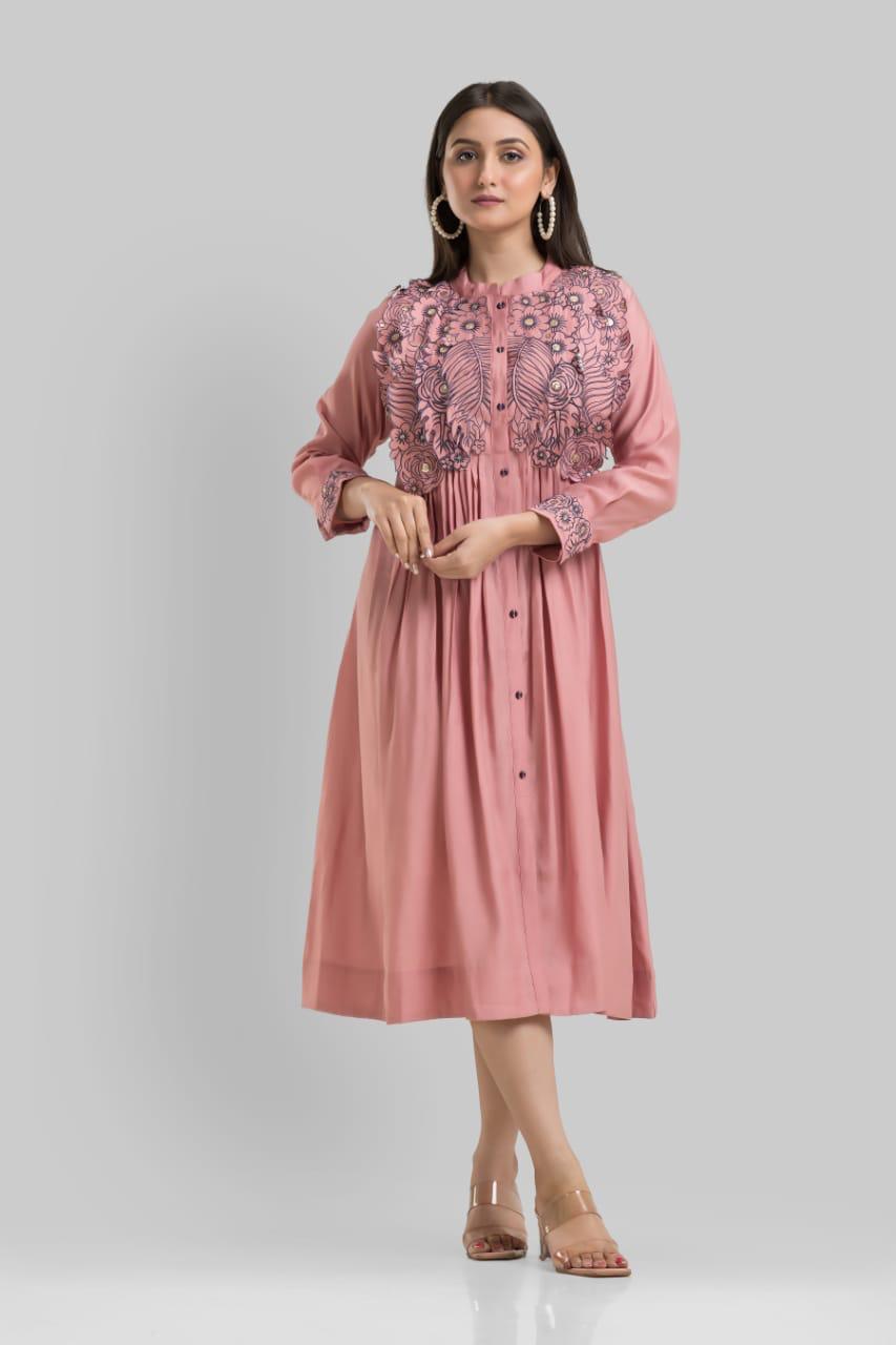 Muslin embroidered one piece dress in peach