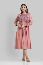 Muslin embroidered one piece dress in peach