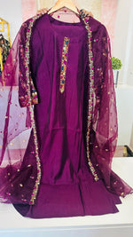Muslin embroidered suit paired with orgenza dupatta