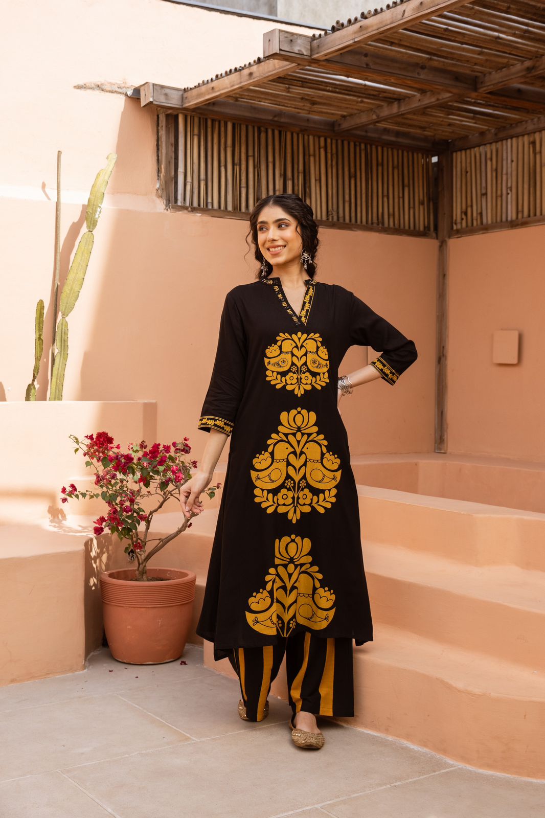 Heavy rayon printed love birds palazzo set in yellow in black .