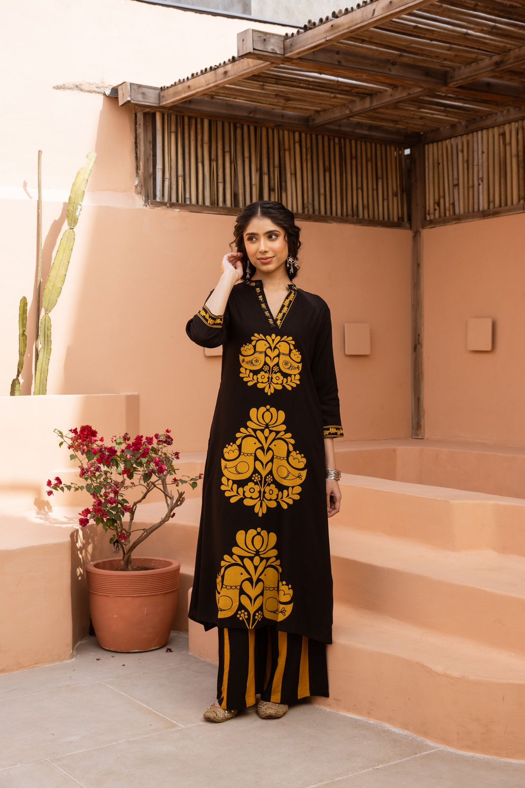 Heavy rayon printed love birds palazzo set in yellow in black .