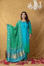 Russian silk paired with Patola dupatta in rama colour