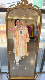 Cutwork pant paired with inner and a floral jacket in yellow