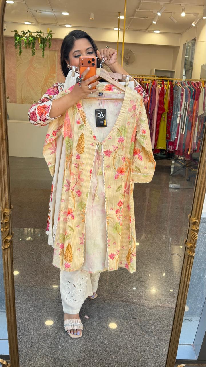 Cutwork pant paired with inner and a floral jacket in yellow