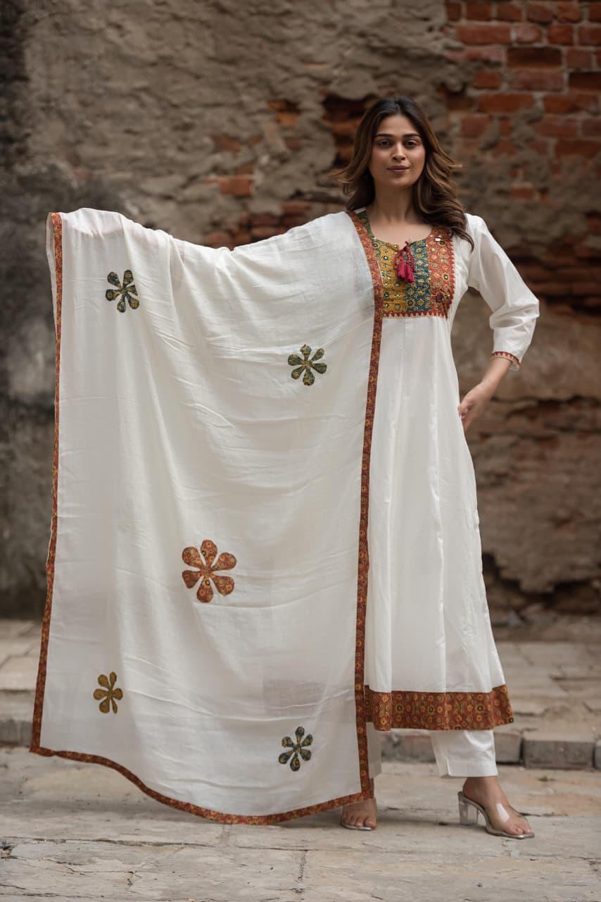 Mul Mul cotton lining applique work full suit set in orange. Kurta has pockets too