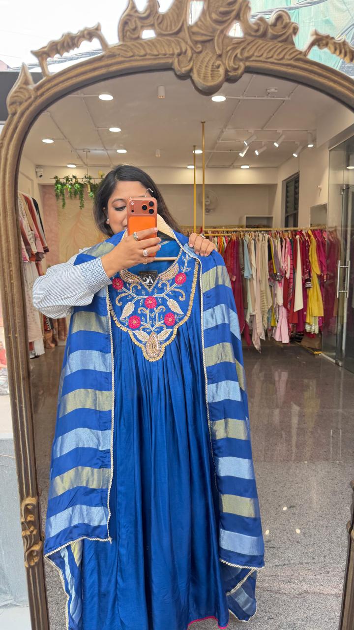 Premium dola silk with heavy hand work paired with a tissue dupatta in royal blue