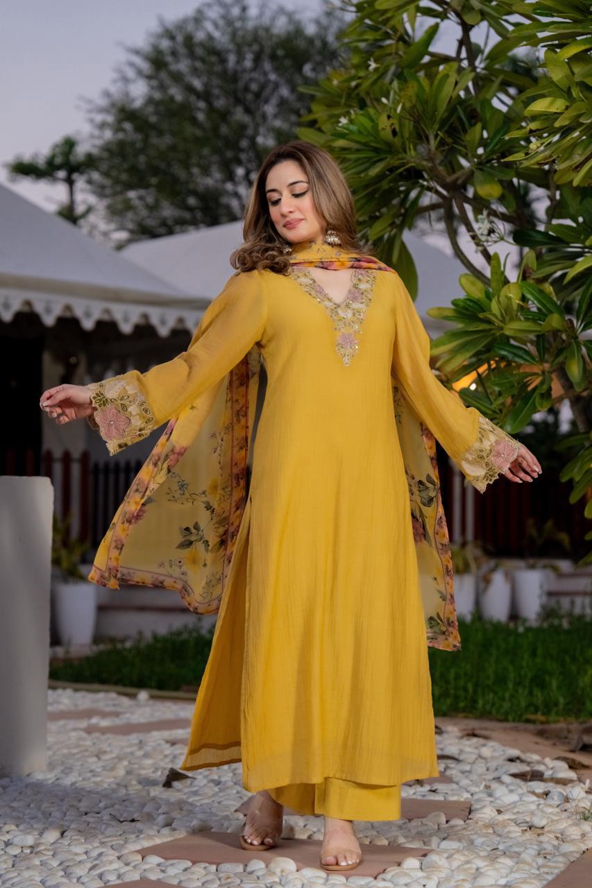 Stylish crush cotton designer suit set in yellow paired with a Kalamkari dupatta