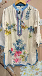 Soft linen top highlighted with pearl detailing and embroidery with lining paired with gorgeous denim