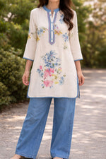 Soft linen top highlighted with pearl detailing and embroidery with lining paired with gorgeous denim