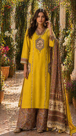 Pretty Kalamkari applique work kurta with designer pocket and back paired with plazzo pant in yellow
