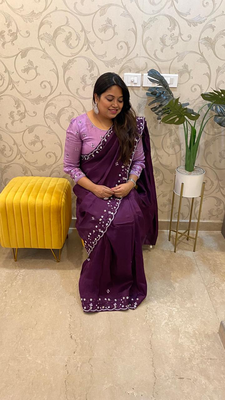 Pretty soft silk saree in wine with handwork comes with stitch blouse