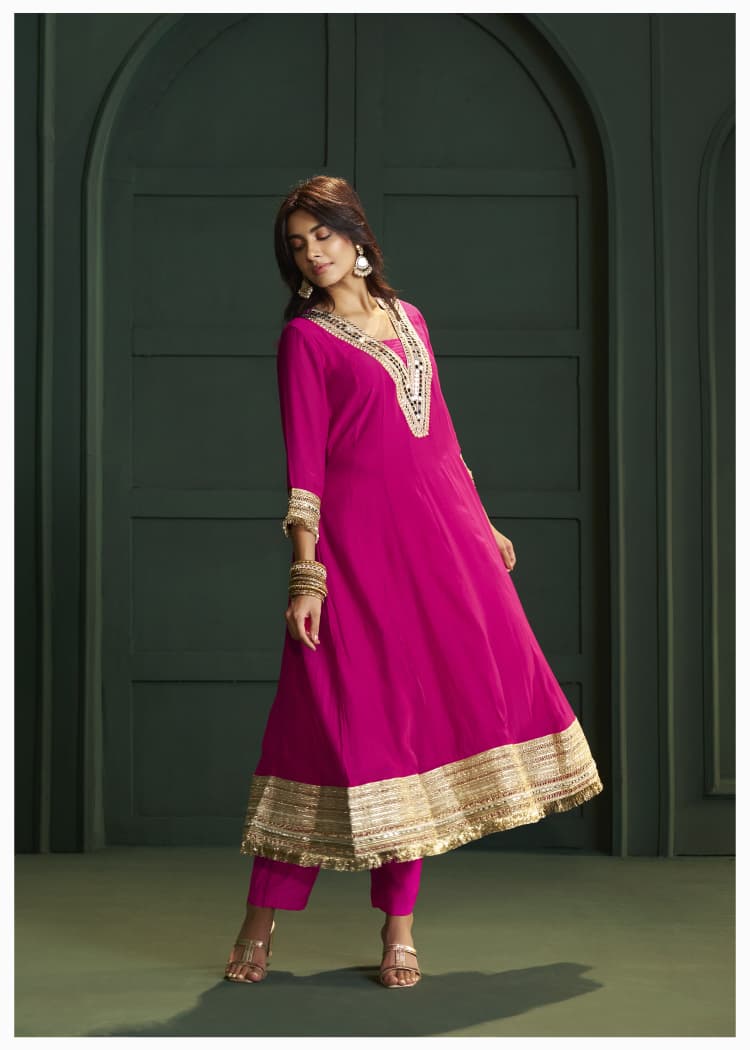Rani pink lace detailing suit set paired with Banarasi dupatta