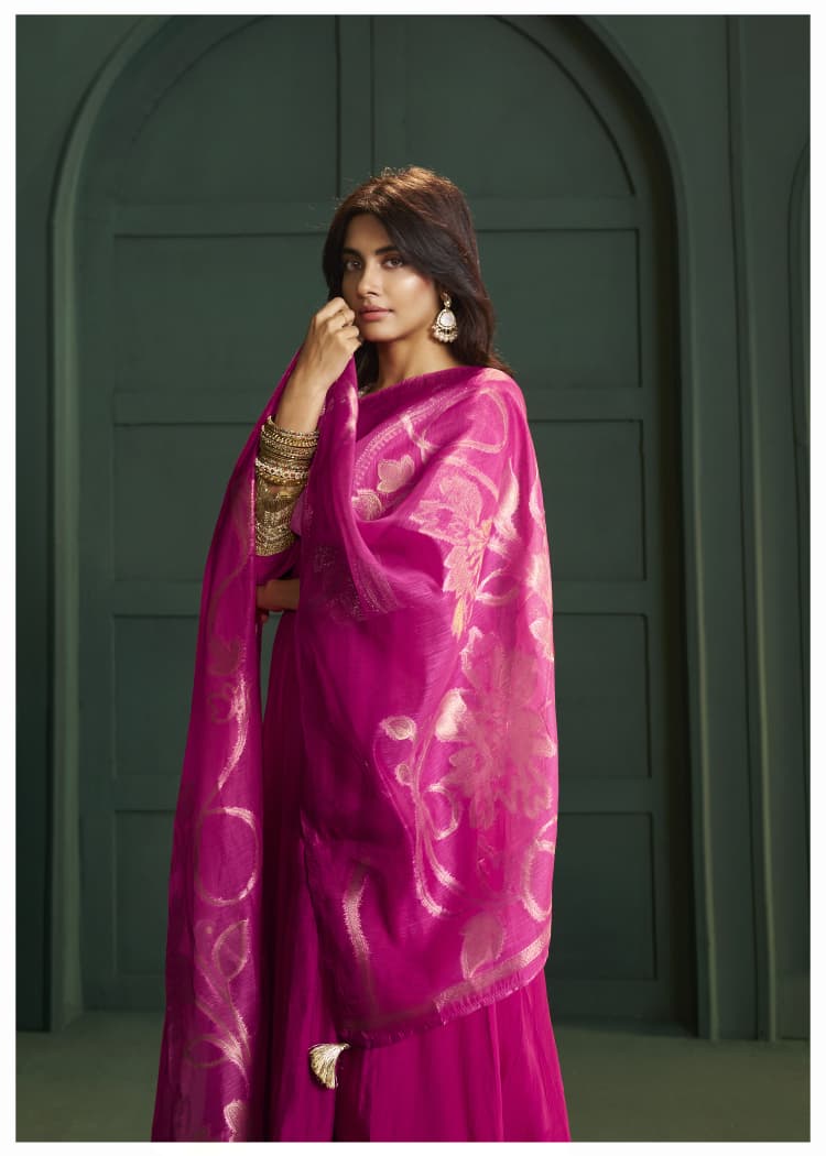 Rani pink lace detailing suit set paired with Banarasi dupatta