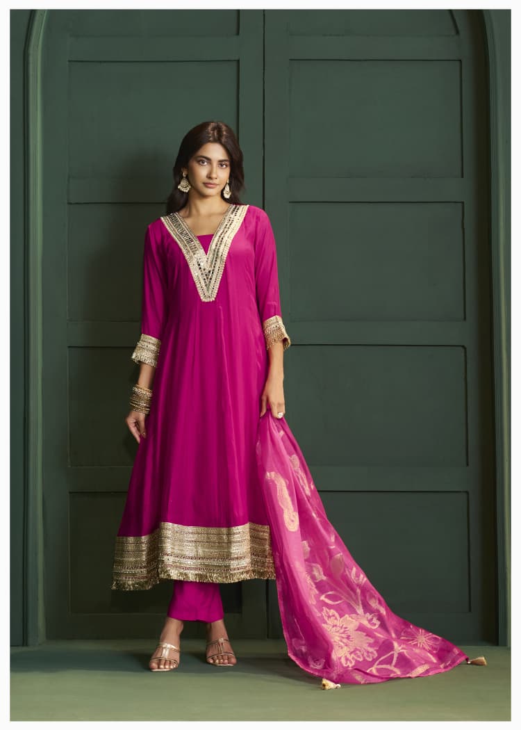 Rani pink lace detailing suit set paired with Banarasi dupatta