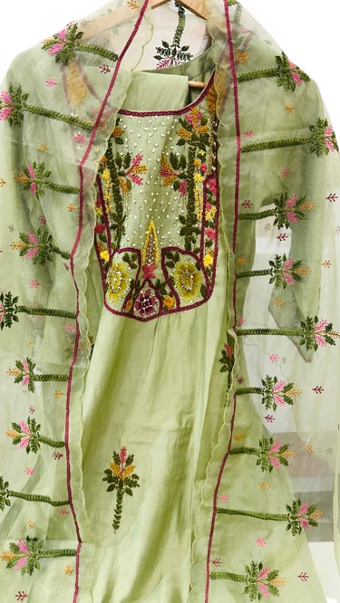 Muslin embroidered suit paired with orgenza dupatta
