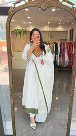 Mul Mul cotton lining applique work full suit set in green. Kurta has pocket too