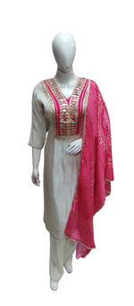 Pretty tissue suit set paired with pink bandhani dupatta