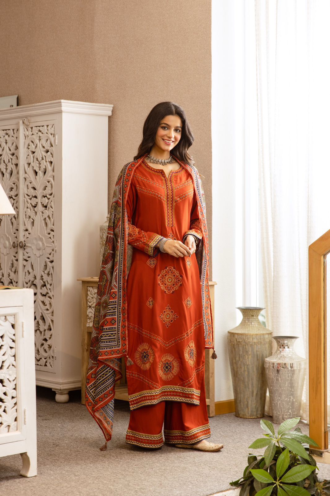Heavy German rayon suit set paired with kalamkari dupatta in rust fully embroidered