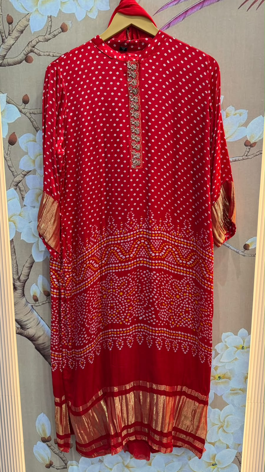 Pure gaji silk lakri patta on sleeves and dress in red bandhani