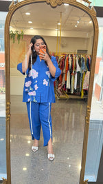 Linen cotton applique work paired with tulip pants and a bag