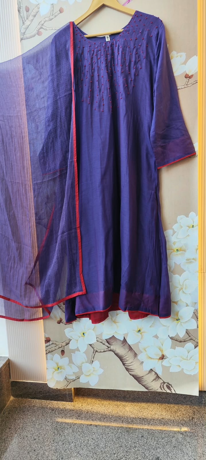 Pure Banarasi Mul chanderi with githan work and red border highlight all over paired with Kota doriya dupatta