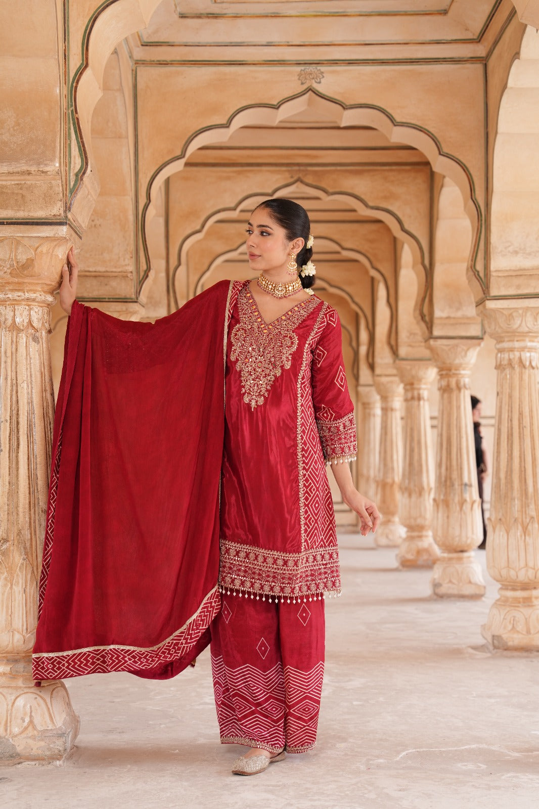 Pure crepe designer with intricate zari detailing suit set in red