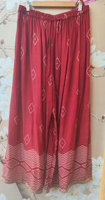 Pure crepe designer with intricate zari detailing suit set in red