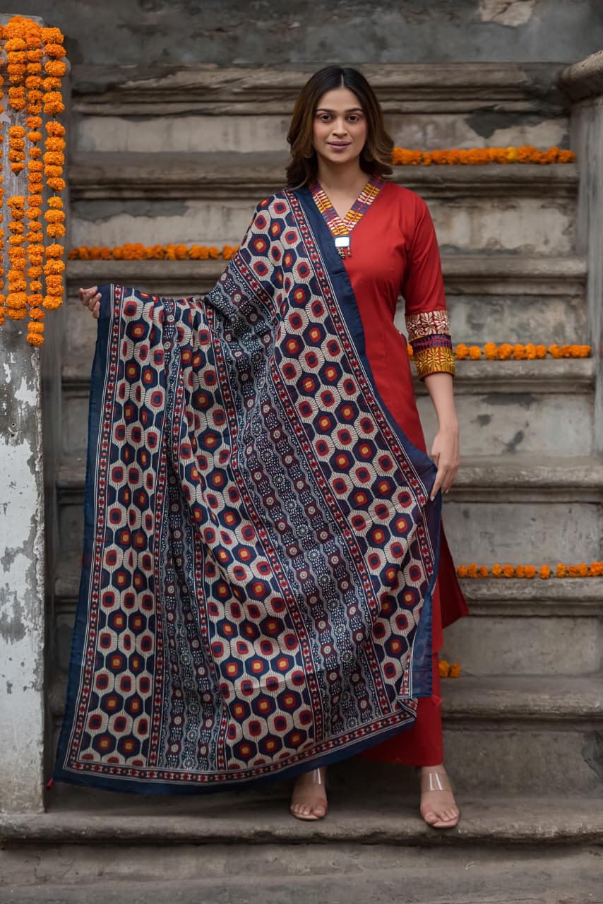 Designer pocket heavy embroidery on sleeves paired with a contrast Kalamkari dupatta cotton suit set in red
