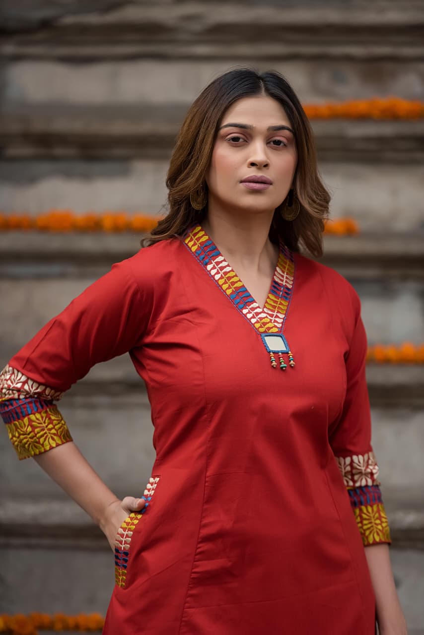 Designer pocket heavy embroidery on sleeves paired with a contrast Kalamkari dupatta cotton suit set in red