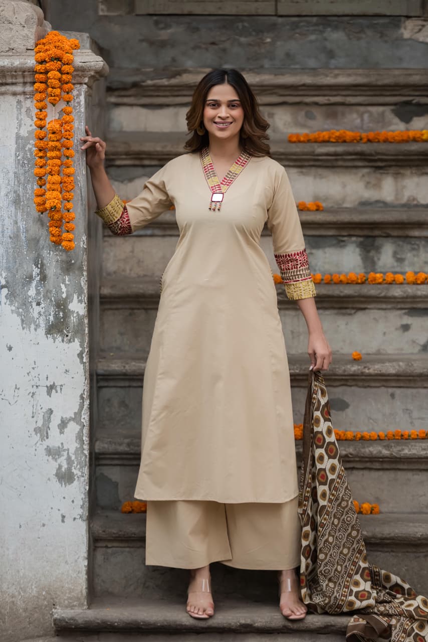 Designer pocket heavy embroidery on sleeves paired with a contrast Kalamkari dupatta cotton suit set in beige