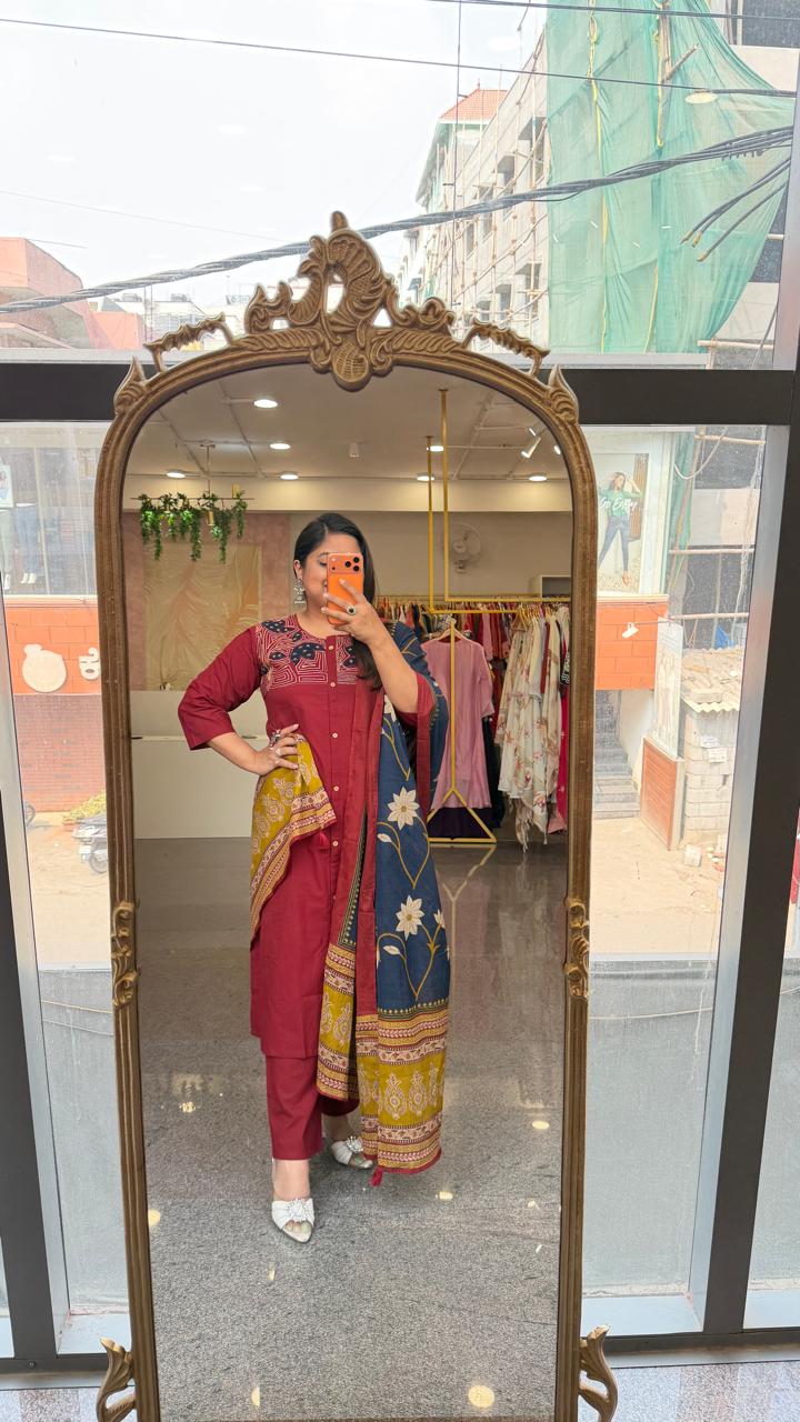 Premium cotton applique work cotton suit in red with pocket and paired with a Kalamkari